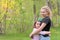 Mom and daughter rest on the green grass