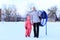 Mom and daughter ride a tubing in winter.