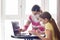 Mom and daughter in self-isolation regime go through online schooling