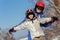 Mom and daughter, in ski equipment play with snow