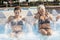 Mom and daughter while spraying water in a whirlpool tub