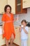 Mom and daughter standing in kitchen