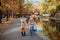 Mom and daughter and walk in the autumn Park near the lake