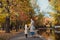 Mom and daughter and walk in the autumn Park near the lake