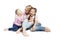 Mom and daughters are sitting and laughing. Love and tenderness. Isolated over white background