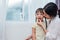 Mom feeding kids with potato chip. Teacher feeding student with