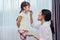 Mom feeding kids with potato chip. Teacher feeding student with