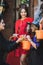 mom giving candies to happy daughters