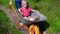 Mom Giving Child Daughter Ride In Wheelbarrow