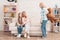 Mom and grandmother give a little girl a big toy bear.