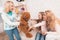Mom and grandmother give a little girl a big toy bear.