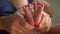 Mom hands foot massage newborn baby