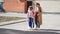 mom helps daughter learn to walk on crutches. plaster on your feet.