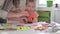 Mom helps her little daughter make decorations for Halloween