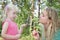 Mom with her daughter in the summer woods.