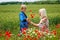 Mom with her son in a magnificent meadow.