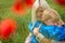 Mom with her son in a magnificent meadow.