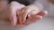 mom holds the hand of a newborn. close-up baby hand. hospital caring happy family medicine concept. baby newborn holding