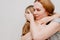 Mom hugs and comforts her little daughter. children& x27;s fears and tantrums.