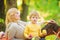 Mom and kid boy relaxing while hiking forest. Family picnic. Mother pretty woman and little son relaxing forest picnic