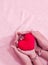 Mom and kid hands holding red heart for V-day concept valentine love little