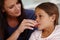 Mom knows best. a caring mother giving her sick little girl some medicine.