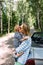 Mom and little son in a convertible car. Summer family road trip to nature