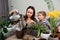 Mom and little son are transplanting houseplants together