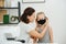 Mom sews protective black mask, tries on her son