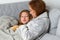 Mom sitting on couch with daughter