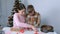 Mom and son are baking making cooking gingerbread cookies together at home.