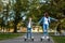 Mom and son ride a hoverboard in the park, a self-balancing scooter. Active lifestyle time with baby technology future