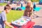 mom and son teenager playing table hockey in the park on a sunny summer day