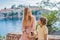 Mom and son tourists on background of beautiful view St. Stephen island, Sveti Stefan on the Budva Riviera, Budva