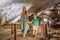 Mom and son tourists in Hang Sung Sot Grotto Cave of Surprises, Halong Bay, Vietnam. Traveling with children concept