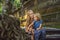 Mom and son travelers discovering Ubud forest in Monkey forest,