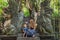 Mom and son travelers discovering Ubud forest in Monkey forest,