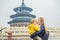 Mom and son travelers in the Temple of Heaven in Beijing. One of the main attractions of Beijing. Traveling with family