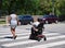 Mom and Son in Wheelchair Crossing Street