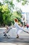 Mom with a stroller crosses the road