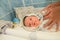 Mom swaddles the baby. on the table of pelina in the bath. Mom and her baby. The concept of a happy family. Beautiful conceptual