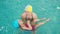 mom teaches to swim a little girl 2 3 years old. Mother and daughter practice swimming in the pool. children\'s sports