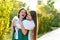 Mom and teenage daughter hugging on walk in park