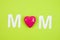 MOM Text with hearts on coloful backround