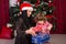 Mom and toddler opening Christmas presents