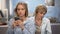 Mom trying to talk to teenage child at home, relations problem, phone addiction