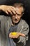 Moment of impact of egg yolk to stretched hand palm