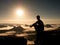 Moment of loneliness. Man with cap sit on mountain and watch to fog