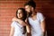 Moments of intimacy. Couple find place to be alone. Couple in love hugs brick wall background. Girl and hipster romantic