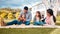 These are the moments well remember forever. a young family having a picnic in a park.